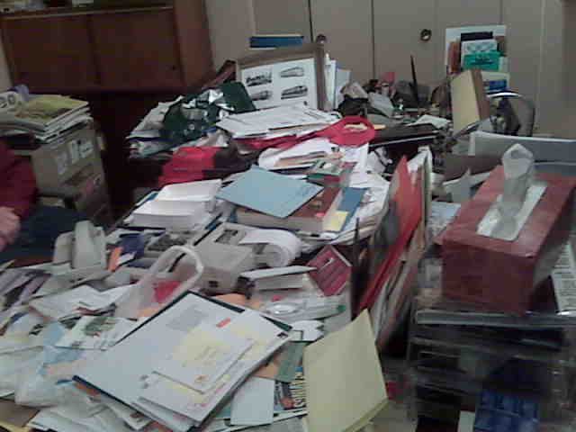 messy desk of AO client